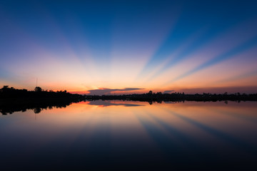 Landscape of calm lake at sunset