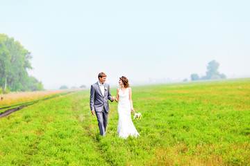 young wedding couple, beautiful bride with groom portrait, summer nature outdoor