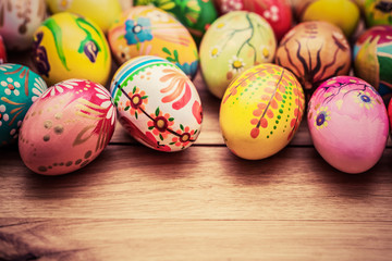 Colorful hand painted Easter eggs on wood. Unique handmade, vintage design.