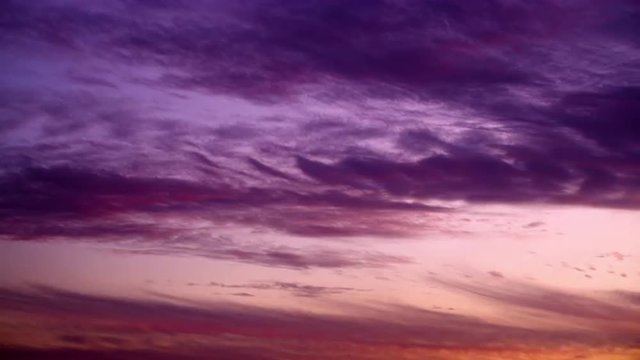 Royalty Free Stock Video Footage of purple clouds at sunset shot in Israel at 4k with Red.
