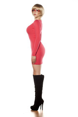 side view of attractive blonde in a tight red dress and boots