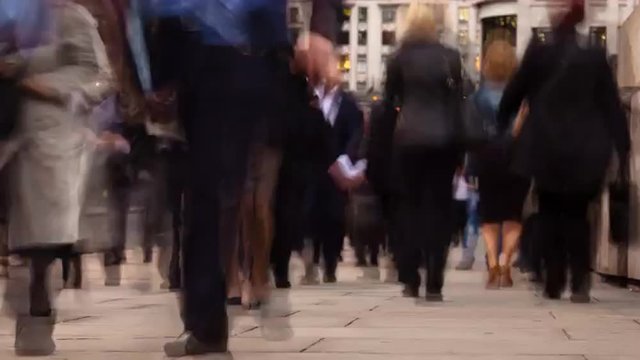 Time-lapse of a crowd of busy people commuting the streets of a big city, London