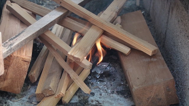 Close up of starting fire in fire pit made of building blocks2.