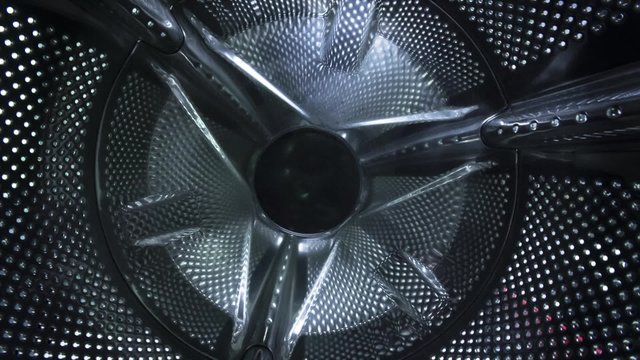 Camera tracks out of the washing machine drum in motion