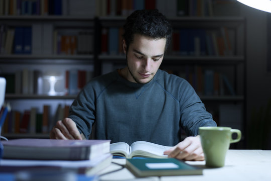 Teenager studying late at night