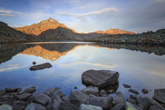 Peak Tambo reflected in Lake Bergsee at dawn, Chiavenna Valley, Spluga Valley