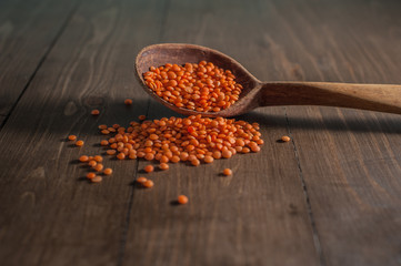 Red Lentils in a Wooden Spoon