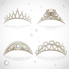 Shining gold tiaras with diamonds and pearls © Azuzl
