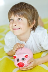 kid with piggy bank 