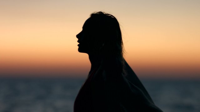 Silhouette of a Slender Young Woman