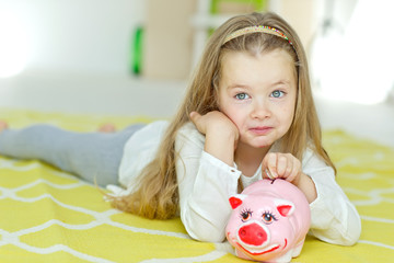kid with piggy bank 