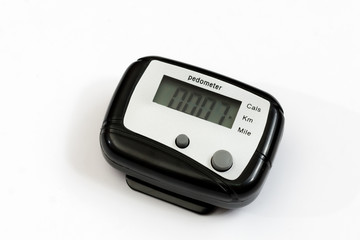 Black pedometer over white background