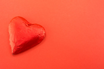 red gloss heart on red ground