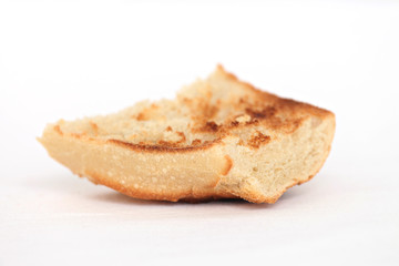 close up of pieces of toast on a white plate