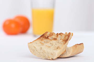 close up of a breakfast with toast and orange juice full of vitamins