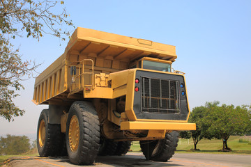 Heavy mining truck in mine and driving along the opencast. Photo
