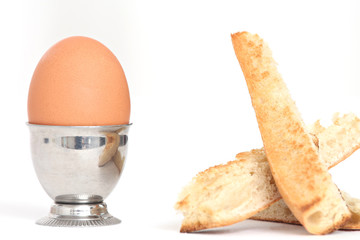 close up of an egg shell and toasted bread slices