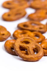 Close macro view of pretzels over white