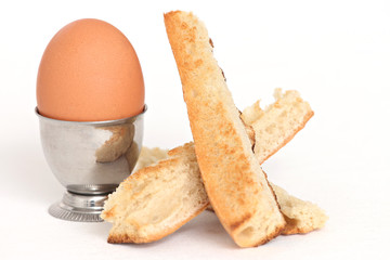 close up of an egg shell and toasted bread slices