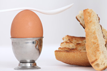 close up of an egg shell and toasted bread slices