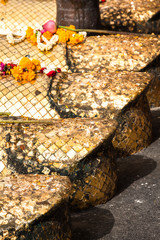 Temple Wat Intharawihan in front of big standing buddha foot