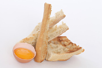 close up of an egg shell and toasted bread slices