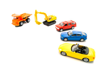 truck, yellow backhoe and other cars
