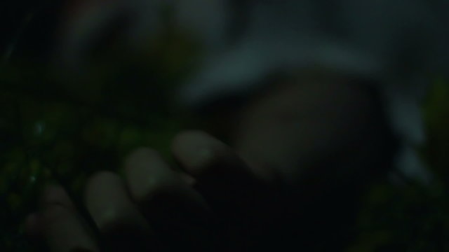 Crazy maniac strangling victim in forest, person shaking from epileptic seizure