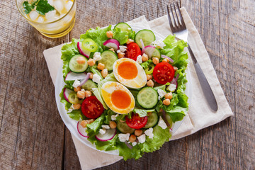 salad with egg tomato cucumber chickpeas cheese