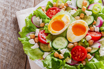 salad with egg tomato cucumber chickpeas cheese