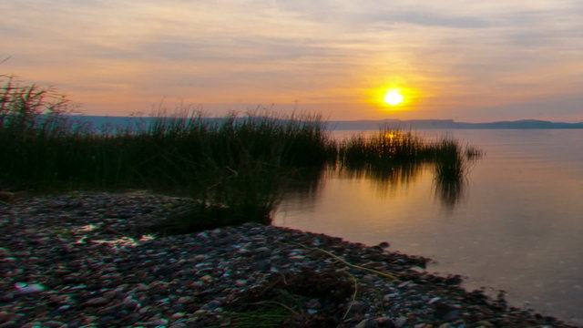 Tracking time lapse of the Sea of Galilee at sunset. Cropped.