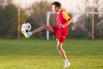 Child playing football