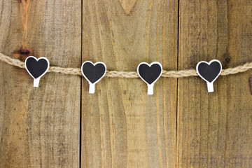 Black and white hearts hanging on rope clothesline