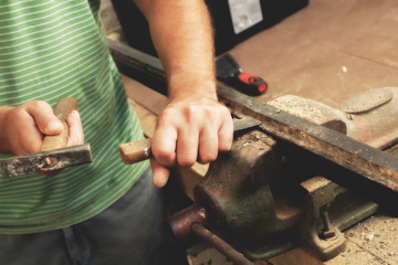 Carpenter working hard in his small 