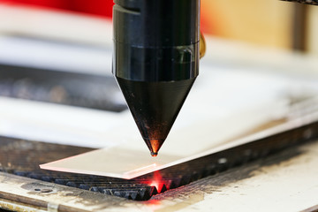 Red laser on cutting machine © vladimirnenezic