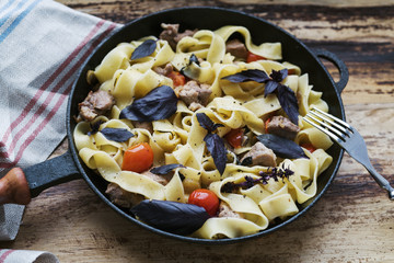 Pappardelle with pork, tomatoes and basil