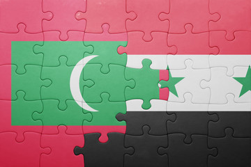 puzzle with the national flag of maldives and syria