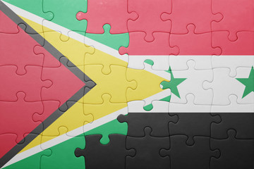 puzzle with the national flag of guyana and syria