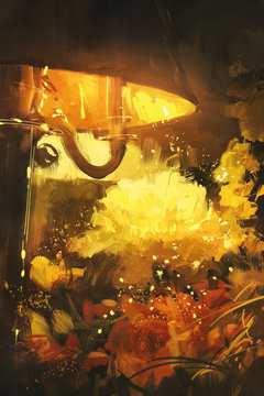 beautiful flowers and lamp glowing orange in the night