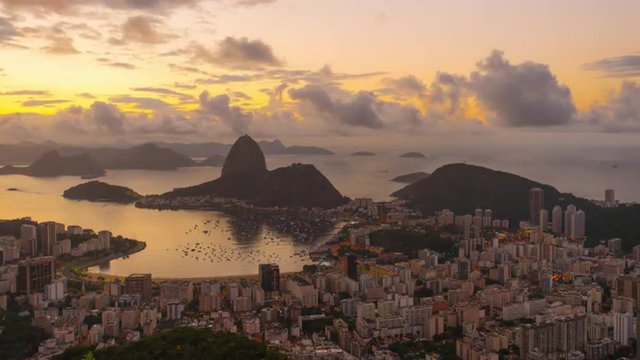 Sunrise time-lapse of Sugar Loaf mountain from behind Rio.