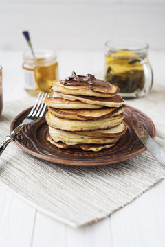 Pancakes with chocolate and honey