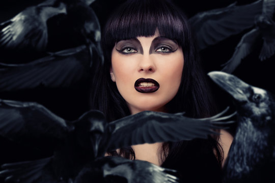 Beautiful dark woman with her crows
