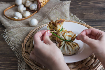 Russian traditional pancakes – bliny. Pancakes in baggies, Hands/Cooking.
