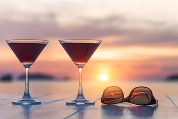 Crédence de cuisine en verre imprimé Cocktail Two cocktails and sunglasses at a beach restaurant, honeymoon, s