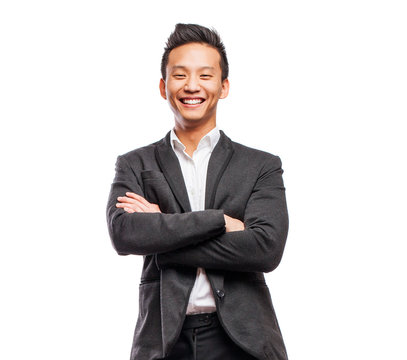portrait of a young asian business man crossing his arms