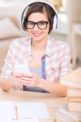 Young student girl using her smartphone