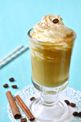 Pumpkin latte with cinnamon,caramel and whipped cream.
