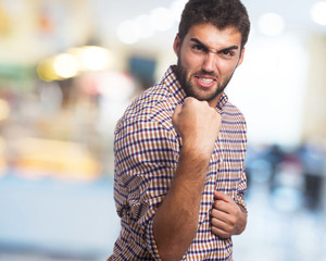 man with fist closed