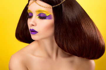 The avantaged portrait girl with an unusual make up , Portrait on a yellow background, custom...