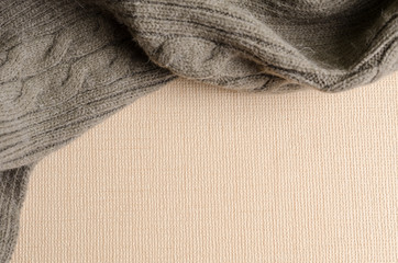 Empty beige paper background with grey wool